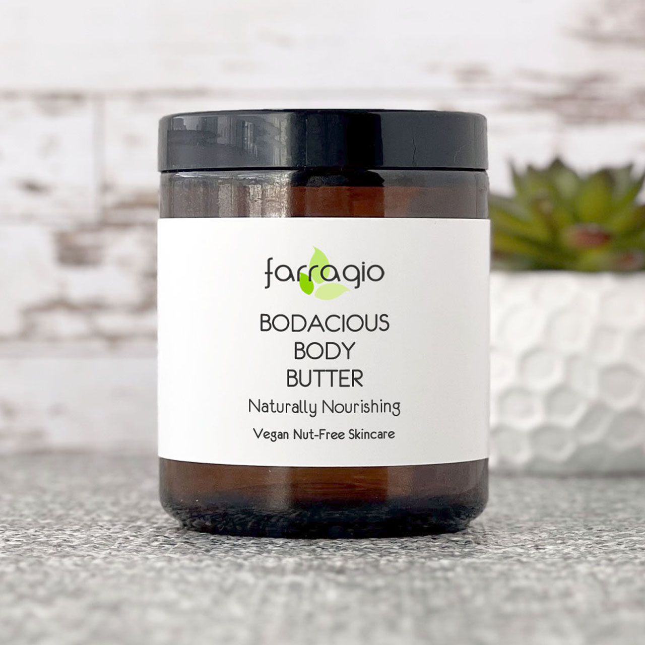 large amber jar of natural body butter