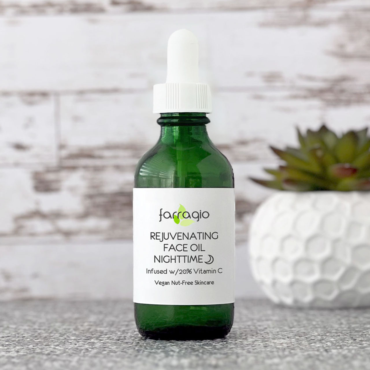 green glass bottle of natural vitamin c face oil skincare